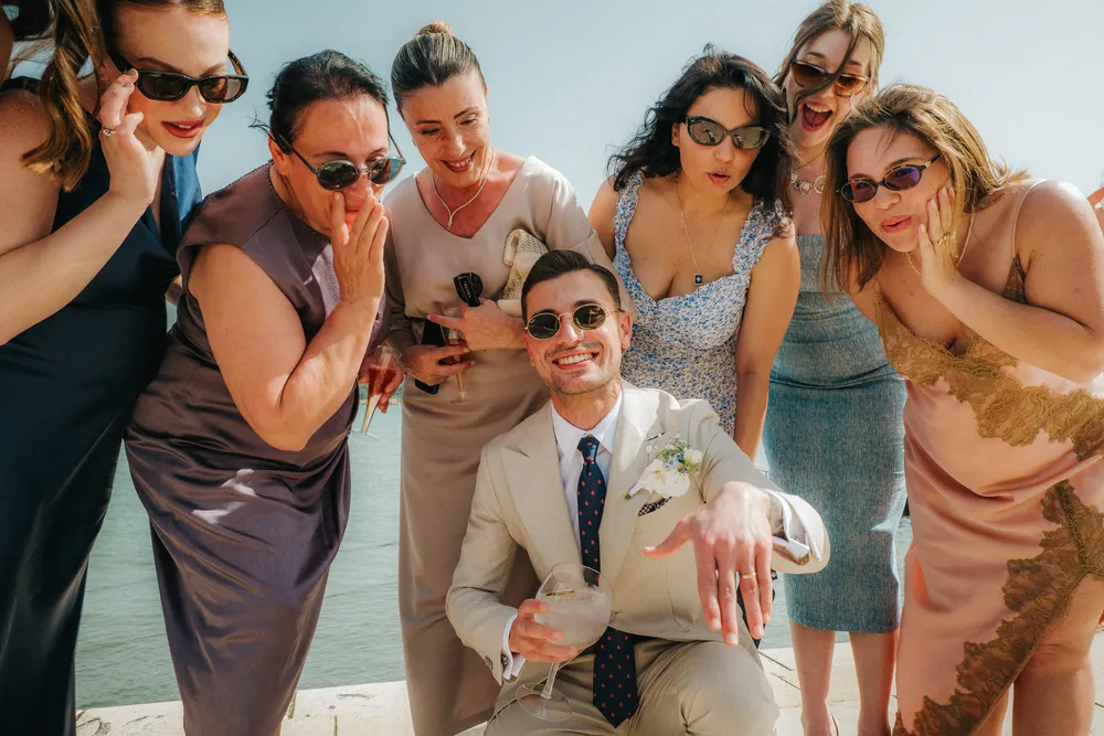 Groom and guests celebrating multi day wedding journey