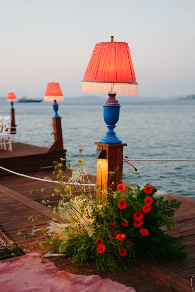 Creative event design and custom lighting decor on pier